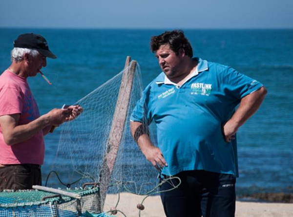 Fishermen discussing their catch